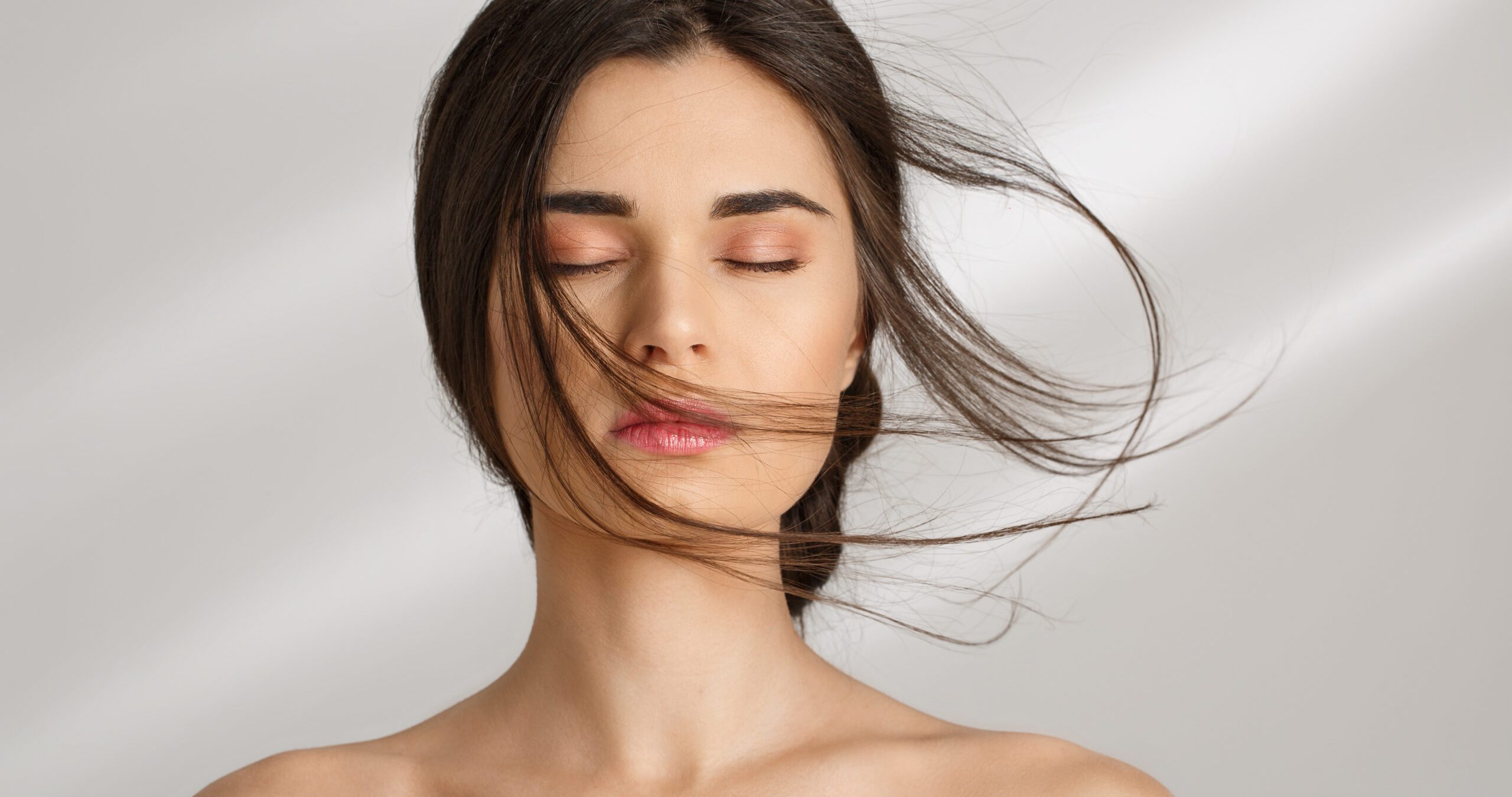 Beautiful woman after spa procedures enjoying herself. Eyes closed. Closeup of beautiful naked woman after spa procedures enjoying herself. Eyes closed. Skin care.