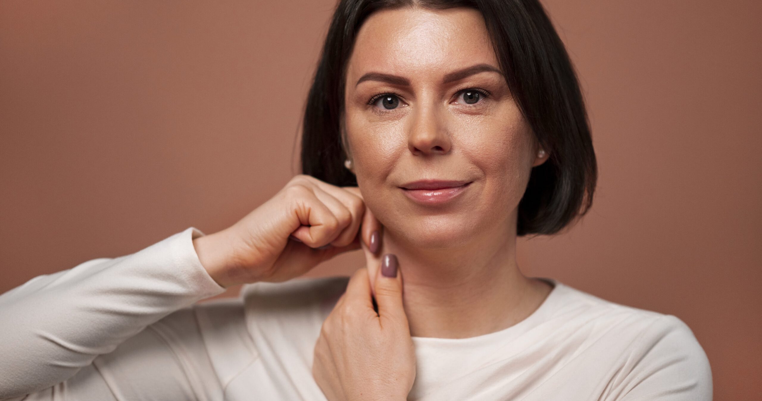 front-view-woman-practicing-facial-yoga front-view-woman-practicing-facial-yoga